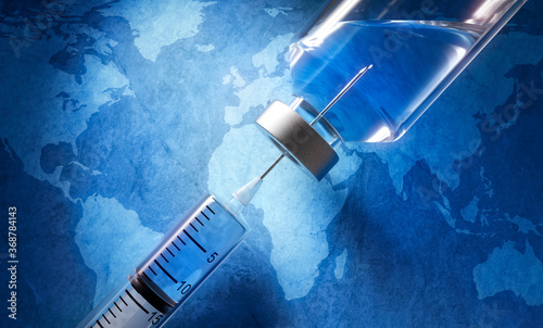 Syringe and vaccine in front of a world map