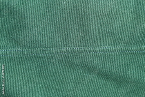 dark green denim jeans texture for background.