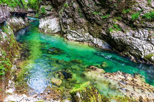 crystal clear water in a mountain river in an alpine gorge