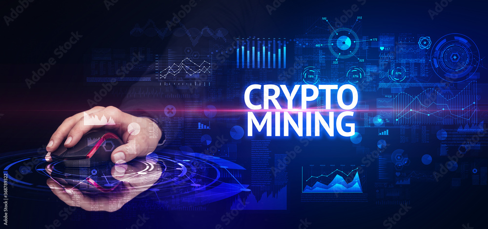 hand holding wireless peripheral with CRYPTO MINING inscription, modern technology concept hand holding wireless peripheral with CRYPTO MINING inscription, modern technology concept