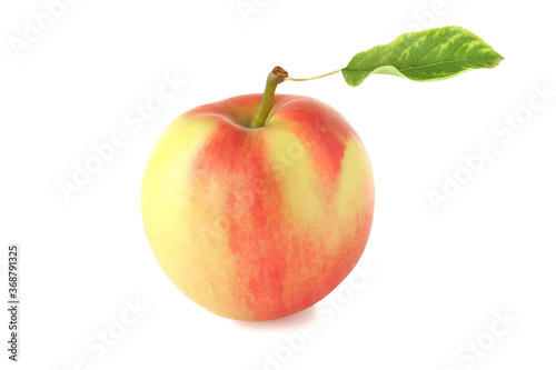 Red-yellow apple with leaf isolated on white
