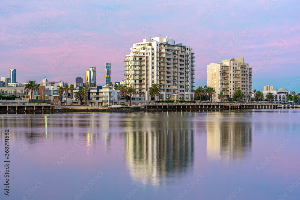 Luxury apartments with city skyline in the background in Port Melbourne, Australia