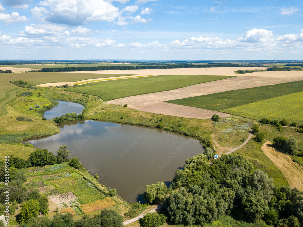 Obraz premium Aerial drone view. Ukrainian agricultural fields in summer.