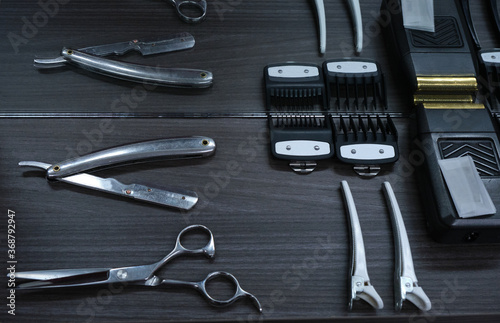 neat hairdressing tools on black table