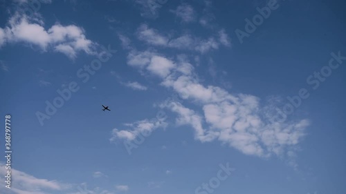 Small red plane flies over the blue sky. Flight lessons at Vadul lui Voda aerodrome in Moldova photo