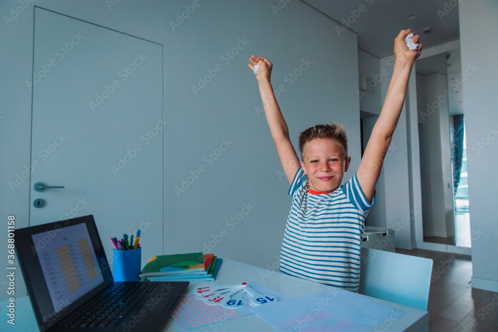 kid enjoy learning online, happy boy passed exam remotely - obrazy, fototapety, plakaty 
