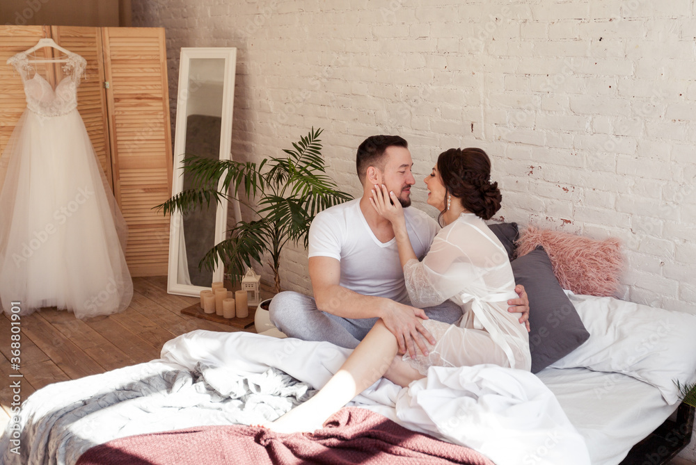 Fototapeta premium a guy with a girl in the bed