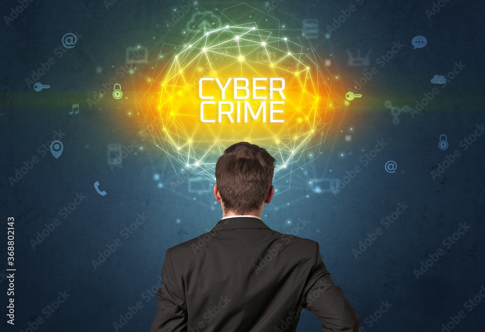 Rear view of a businessman with CYBER CRIME inscription, online security concept