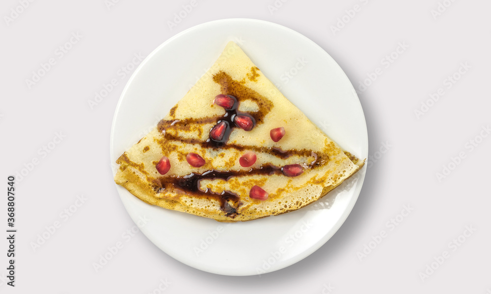 Pancakes with syrup on plate on a white background