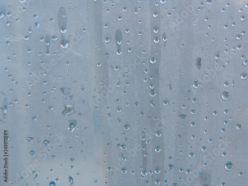 Drops after rain on the fogged film. Raindrops on the glass.
