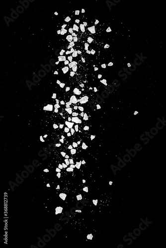 Obraz na płótnie Close-up of macro crystals of sea salt or coarse salt isolated on black backgrou