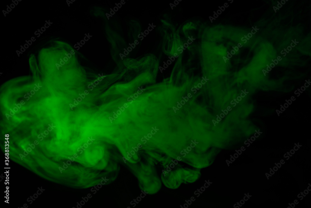 Fototapeta premium Green steam on a black background.