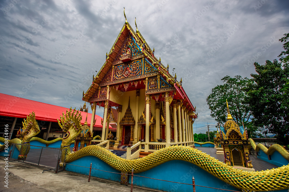 Naklejka premium Wat Khiriwan-Nakhon Nayok: 1 August 2020, atmosphere within a religious tourist site, with tourists visiting for merit during the holidays in Si Nawa area, Mueang Nakhon Nayok, Thailand.