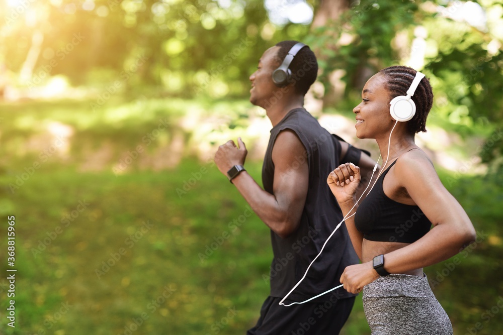 Sporty man jogging in a park stock photo