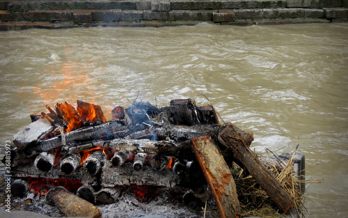 Burning Hindu funeral pyre,Hindu funeral rights of burning the body on a tall wooden funeral pyre in Nepal