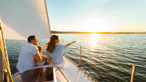 Family Of Three Sailing On Yacht At Seaside Outdoor, Panorama © Prostock-studio