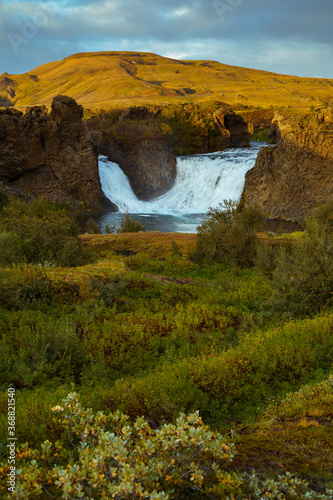 Hjalparfoss waterfall in South Iceland at sunset. Beautiful nature landscape