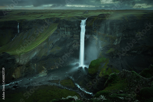 Haifoss waterfall in South Iceland in the dusk. Beautiful nature dramatic moody landscape