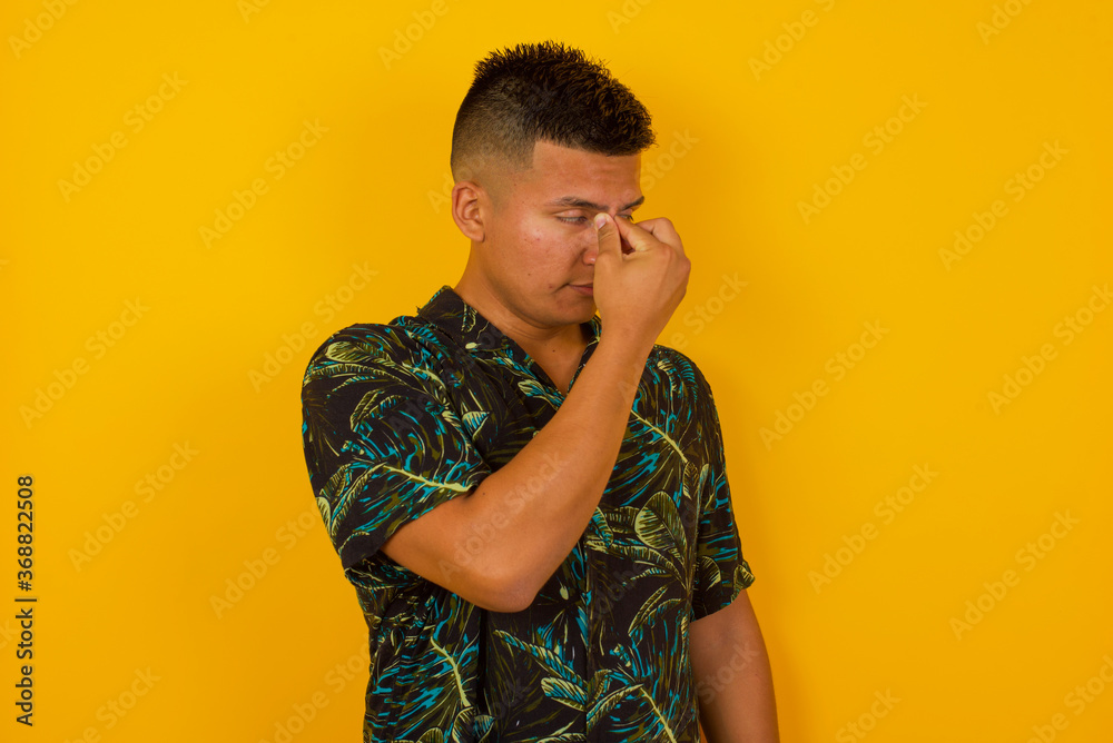 Very upset, charming, nice man touching nose between closed eyes standing outdoors, want to cry, having stressful relationship, worry about conflict with his lover or having troubles with work Very upset, charming, nice man touching nose between closed eyes standing outdoors, want to cry, having stressful relationship, worry about conflict with his lover or having troubles with work