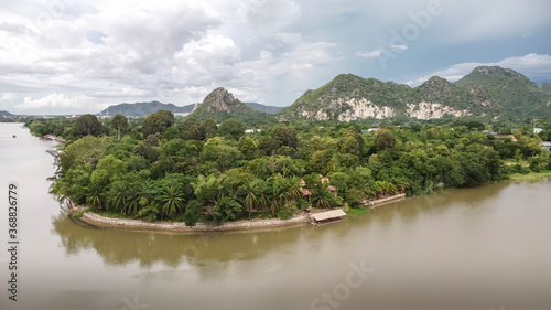Panorama is views of the River Kwai and the mountains of Kanchanaburi Thailand.