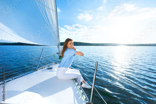 Woman Sitting On Yacht Relaxing Looking At Sea Sailing Outdoors