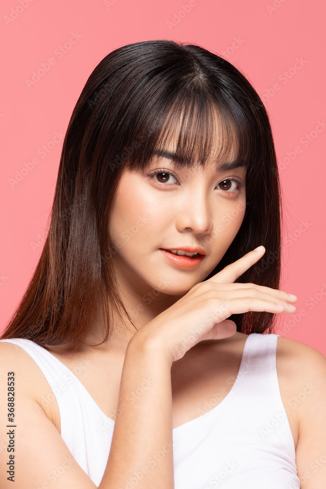 Beautiful Asian woman touching soft cheek smile with clean and fresh skin Happiness and cheerful with positive emotional,isolated on pink background,Beauty Cosmetics and spa Treatment Concept Beautiful Asian woman touching soft cheek smile with clean and fresh skin Happiness and cheerful with positive emotional,isolated on pink background,Beauty Cosmetics and spa Treatment Concept
