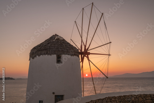 Traditional windmills, the symbol of Mykonos at sunset, Greece