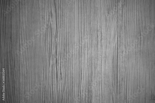 Wooden wall with texture and grain in dark black and white tone for background and decoration Cool banner on page and cover