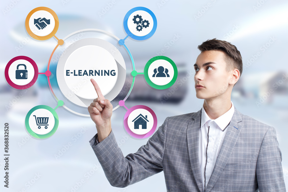 Business, Technology, Internet and network concept. Young businessman working on a virtual screen of the future and sees the inscription: E-learning Business, Technology, Internet and network concept. Young businessman working on a virtual screen of the future and sees the inscription: E-learning