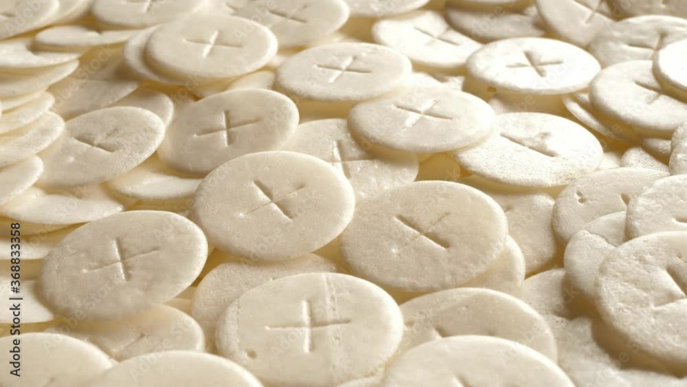 communion hosts sacramental breads turning round rotating flat lay top view communion hosts sacramental breads turning round rotating flat lay top view