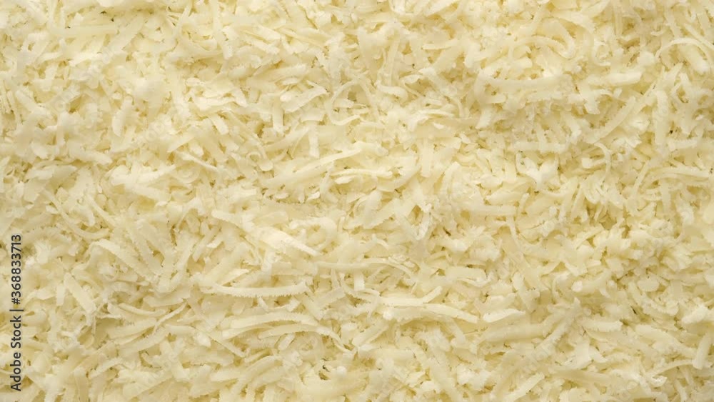 cheese parmesan grated close up, rotating cheese parmesan grated close up, rotating