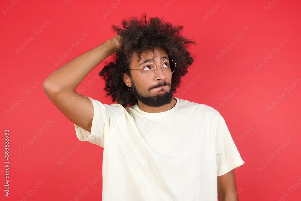 Oops, what did I do? Handsome blond man holding hand on head with frightened and regret expression. Wearing casual clothes standing against gray background. Oops, what did I do? Handsome blond man holding hand on head with frightened and regret expression. Wearing casual clothes standing against gray background.