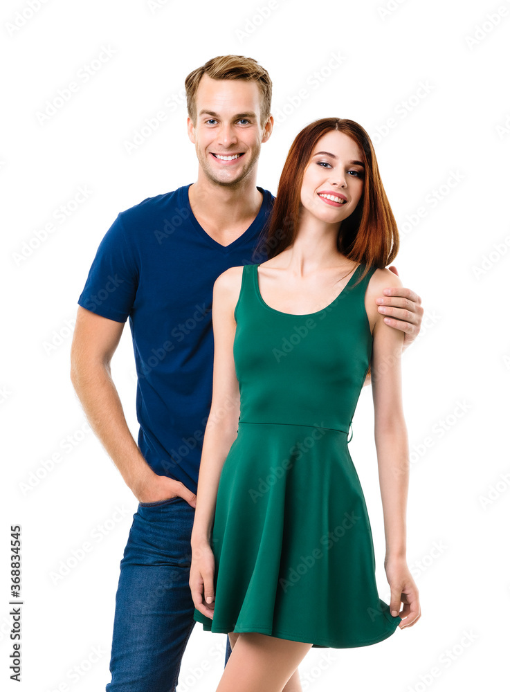 Smiling attractive amorous couple. Portrait image of standing close and looking at camera models at happy in love studio concept, isolated over white background. Man and woman posing. Smiling attractive amorous couple. Portrait image of standing close and looking at camera models at happy in love studio concept, isolated over white background. Man and woman posing.