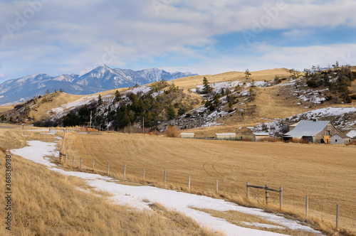 Pasture land and barn at Bozeman Pass on Old Boseman Hill Road Montana with Mount Delano of Absaroka Range photo