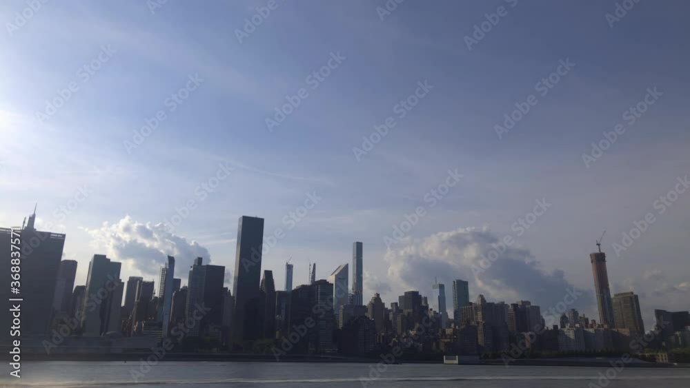 time-lapse of landscape midtown manhattan NYC and clouds at evening time time-lapse of landscape midtown manhattan NYC and clouds at evening time