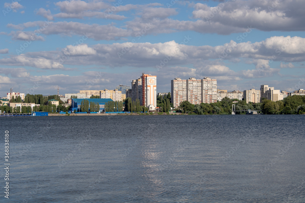 Russia, Voronezh. Residential area on the left bank, view from the right bank of the embankment to the left bank.