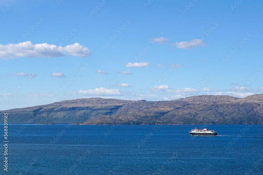 A ferry boat passing the Isle of Mull in Scotland.
