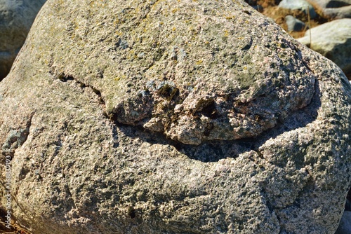 Ancient brown stones, texture, close-up. Natural pattern, background. Baltic sea, Kasmu nature reserve, Estonia. Graphic resources, macro photography, concept art, tranquility, pure nature concepts photo