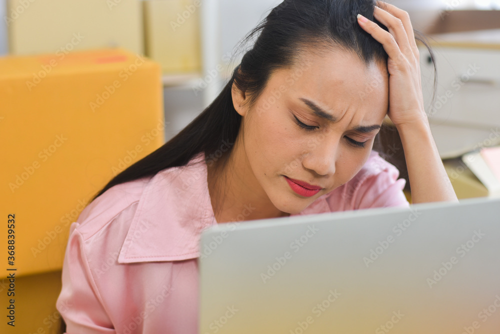 Headache Asian woman work from home with laptop Headache Asian woman work from home with laptop