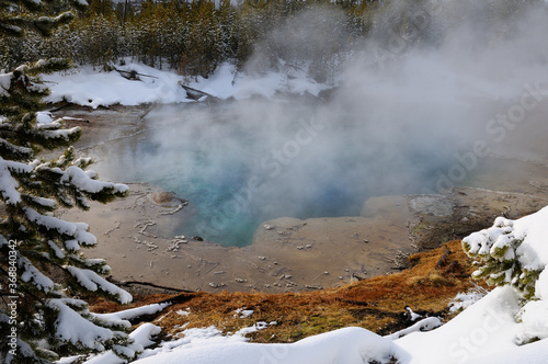 Steaming turquoise water of Emerald Spring in Norris Geyser Basin Yellowstone Nation Park in winter