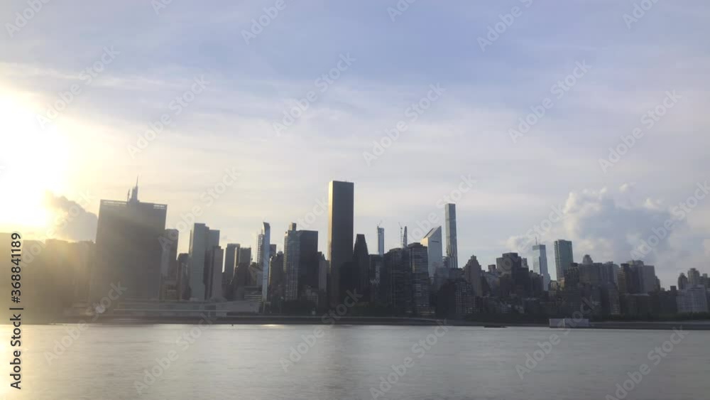 time-lapse of landscape midtown manhattan NYC and clouds at evening time time-lapse of landscape midtown manhattan NYC and clouds at evening time