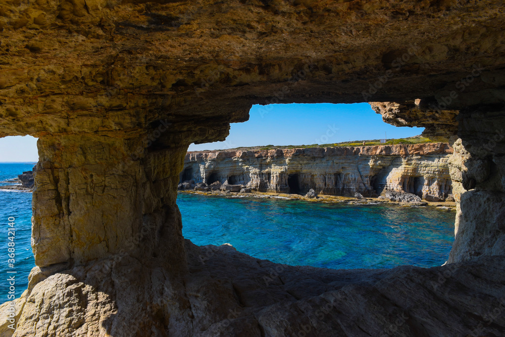 Amazing view of sea caves at Cape Greco, Ayia Napa, Cyprus, natural window