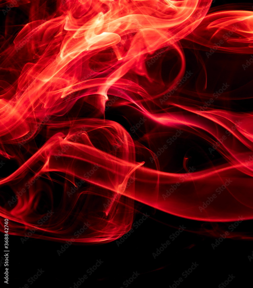Red smoke on black background