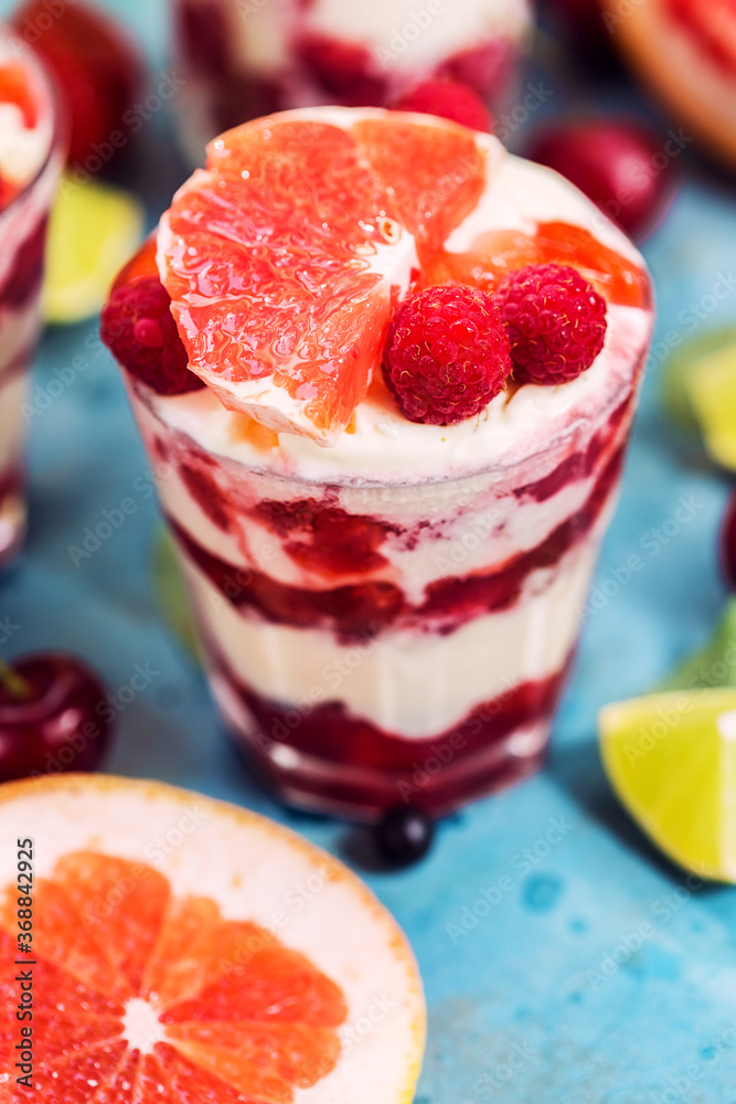 Dessert with grapefruit, berry, raspberry and ice cream