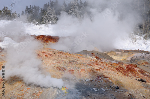 Hot steam in winter from Steamboat Geyser and fumarole in Norris Geyser Basin Yellowstone Park