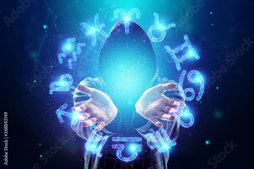 Sorcerer, magician and 12 signs of the zodiac, hologram neon horoscope signs on a blue background. with the concept of fate, predictions, fortune teller.