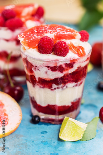 Desserts with sweet strawberry, raspberry, ice cream and grapefruit