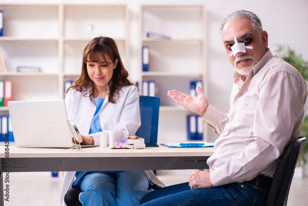 Old man visiting young female doctor for plastic surgery