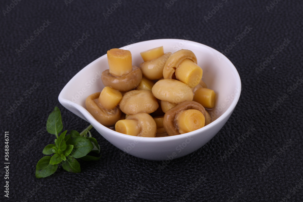 Pickled champignon heap in the bowl Pickled champignon heap in the bowl