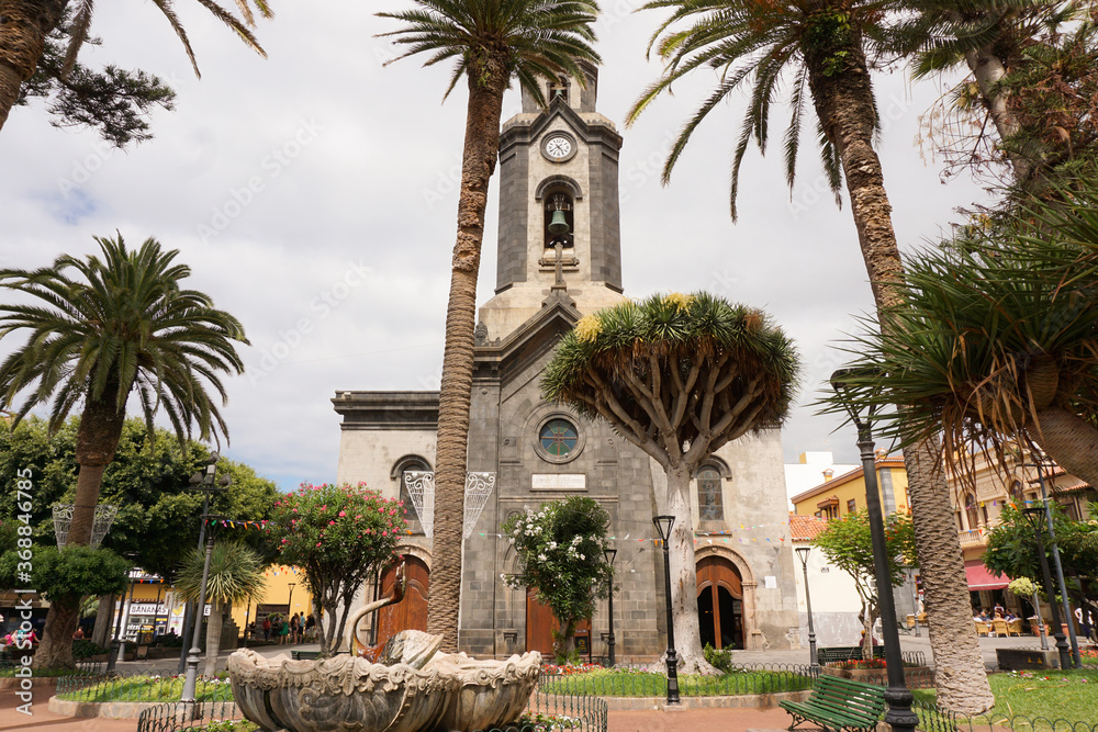 church with palm trees in the foreground in Tenerife